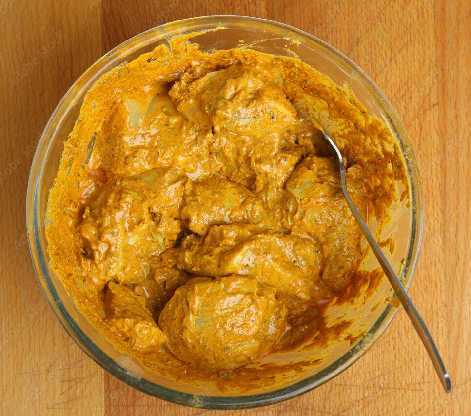 Chicken Tikka Masala garnished with fresh cilantro, served with basmati rice or naan.