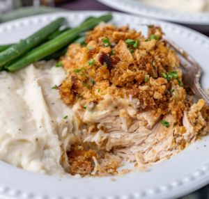 Crockpot Chicken and Stuffing served in a bowl, garnished with parsley