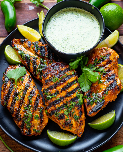 A golden Peruvian chicken served with a creamy sauce.